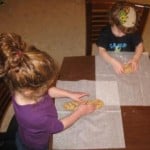 Reader Kate's kids shaping challah dough