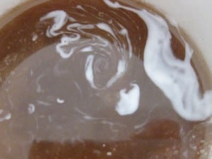 swirling coffee and cream