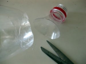 cut the spout below the mouth of the bottle
