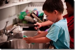 child-wash-dishes