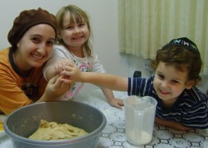 Yosefa and family making challah