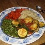 vegetarian meal with peas, rice, carrots and zucchini