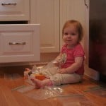 toddler getting into a drawer in the kitchen