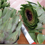 fresh artichokes being prepared for cooking in pressure cooker