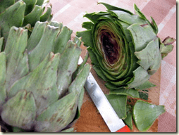 artichokes being prepared for cooking