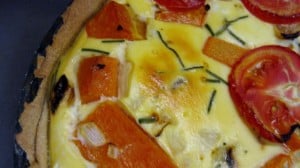 winter squash quiche with tomatoes, chives, cheese and whole-wheat oil crust