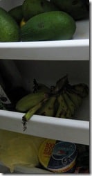 refrigerator containing white choose, bananas, avocados and cabbage