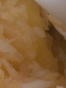 uneven pieces of potatoes in the food processor