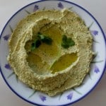 Chumus with coriander and parsley in bowl